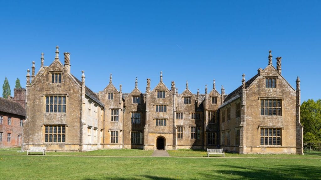 Warner Hotels sale: a grand English manor house with turrets and formal lawns