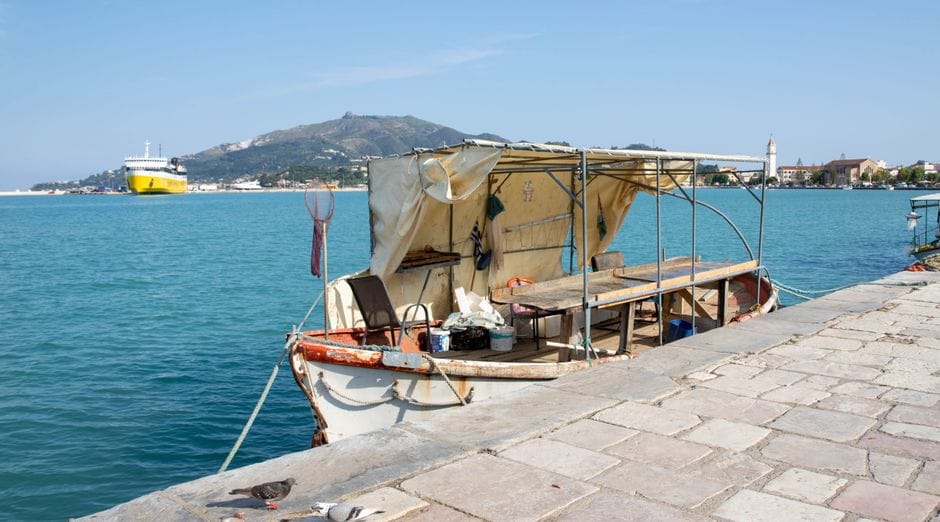 A rustic fishing boat docked at a Zakynthos harbour