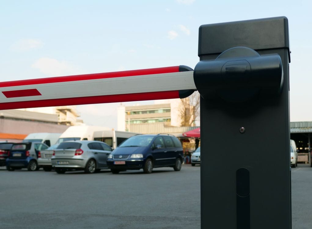 A car park barrier gate: booking online in advance almost always beats paying on the day at the barrier