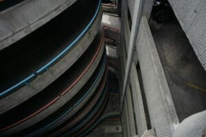 How far in advance to book airport parking: a spiral multi-storey car park seen from above