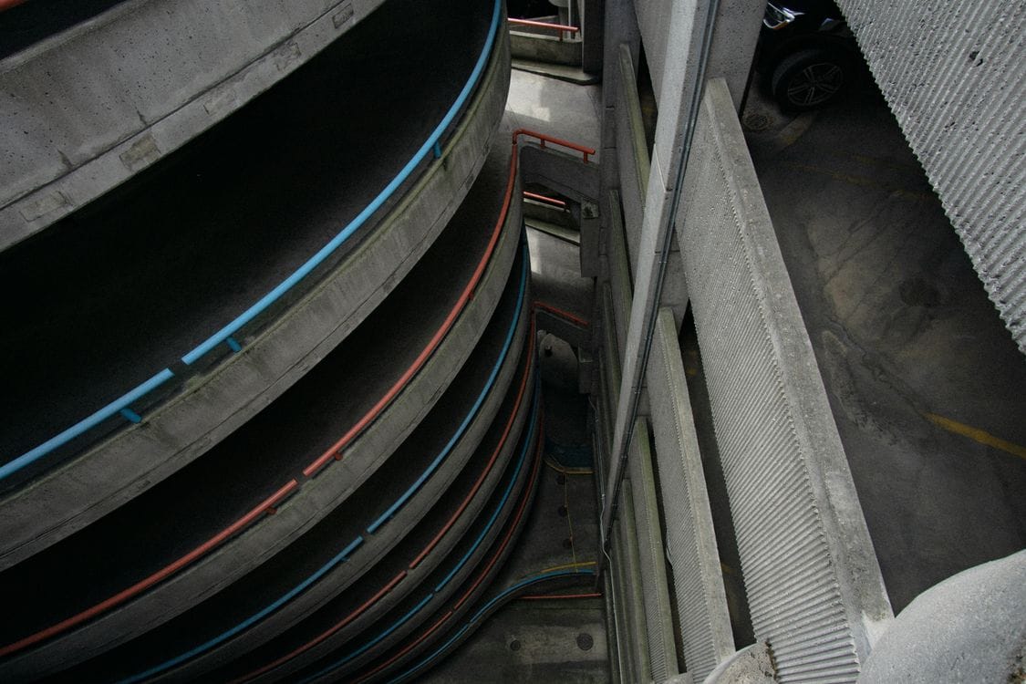 How far in advance to book airport parking: a spiral multi-storey car park seen from above