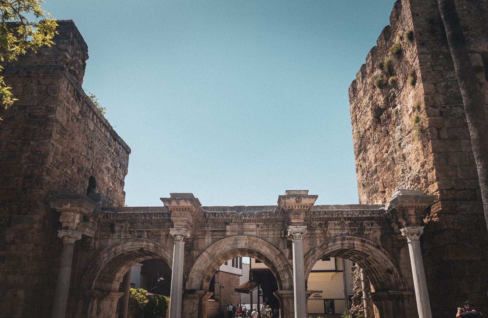 Hadrian's Gate in Antalya, a triple-arched Roman triumphal arch with marble columns marking the entrance to Kaleici
