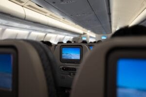 British Airways WiFi: rows of seatback screens lit up inside a cabin