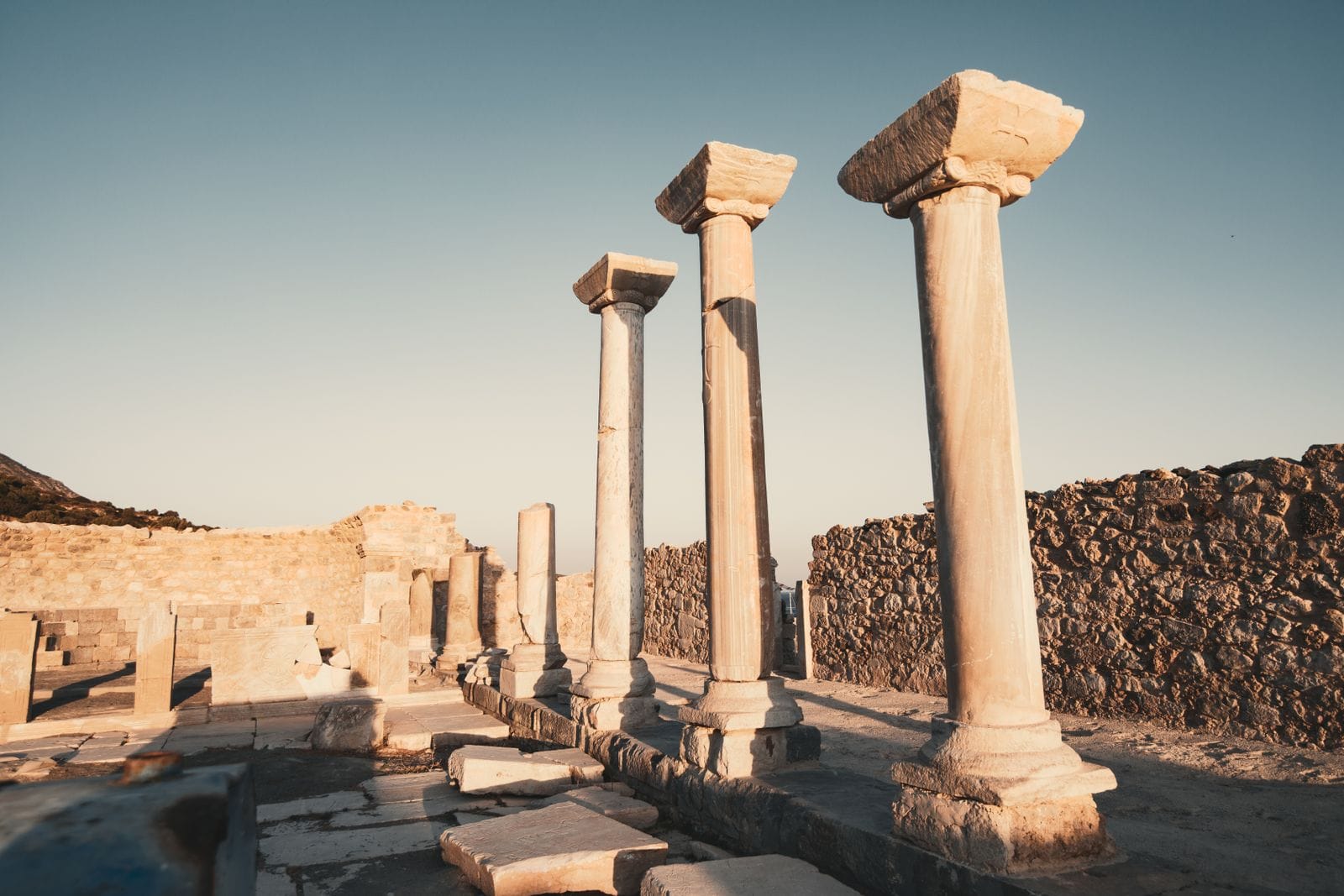 Ancient marble columns standing among the ruins of the archaeological site on Delos, near Mykonos