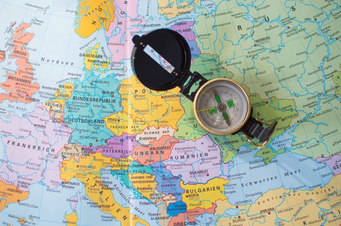 A compass resting on a map of Europe: roaming coverage and fair-use caps vary country by country