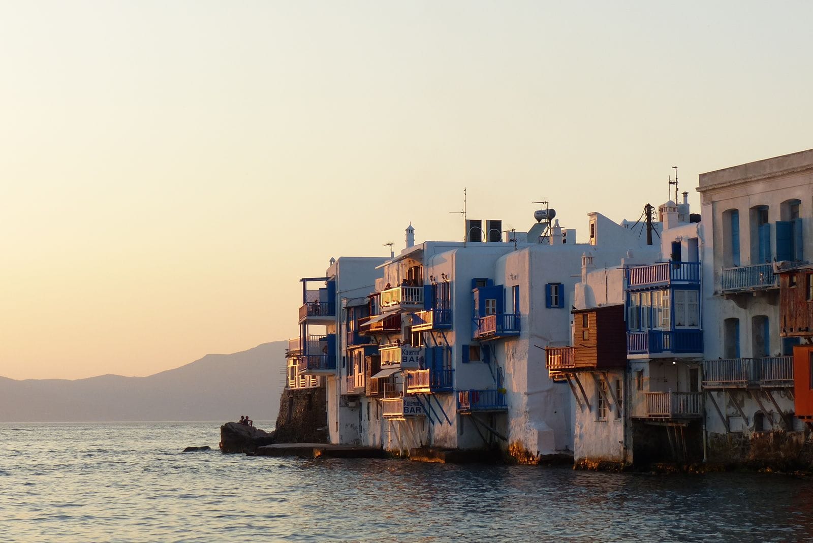 Little Venice in Mykonos Town at sunset, balconied houses built at the water's edge