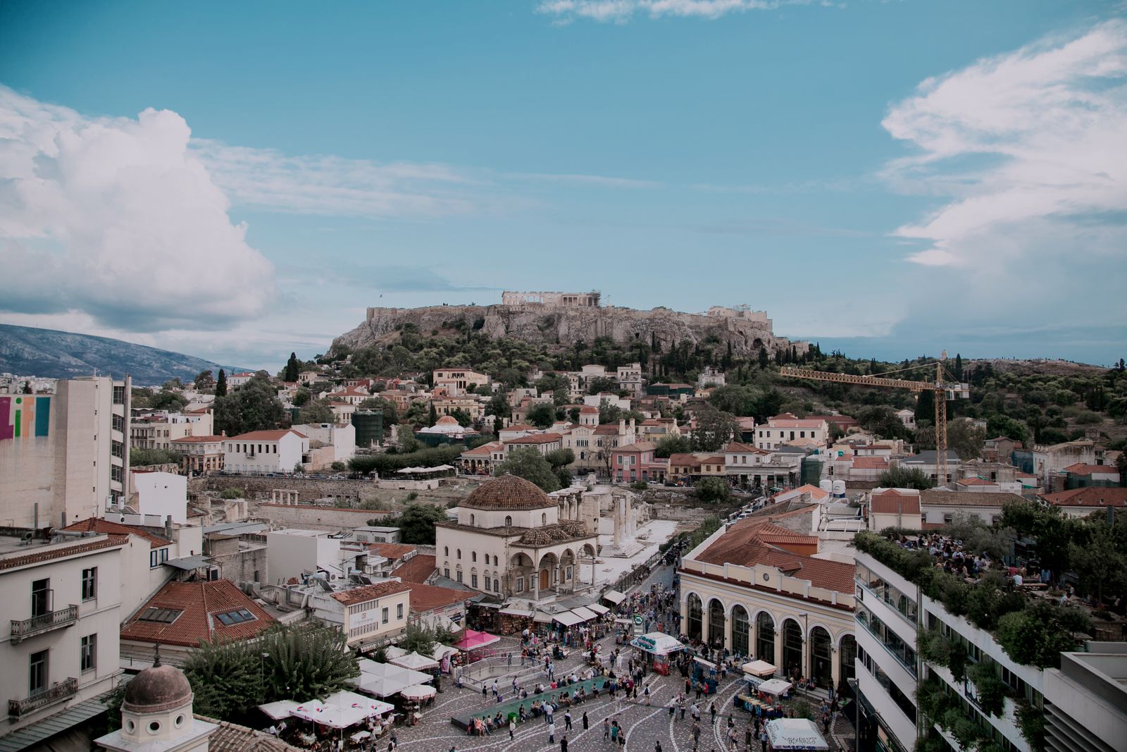Monastiraki Square in Athens, with the Acropolis rising on its hill above the rooftops