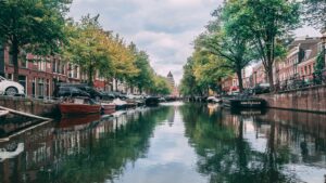 Amsterdam canal with historic houses and boats