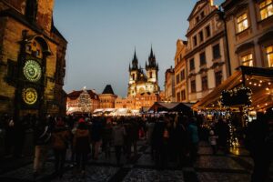 Crowds at the Christmas market in Prague's Old Town Square beside the astronomical clock, an easyJet Christmas markets destination