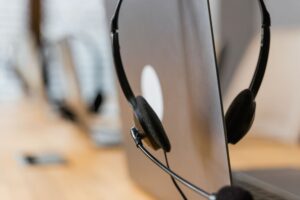 A headset hanging on a laptop screen: Jet2 complaints are handled in writing, not by phone