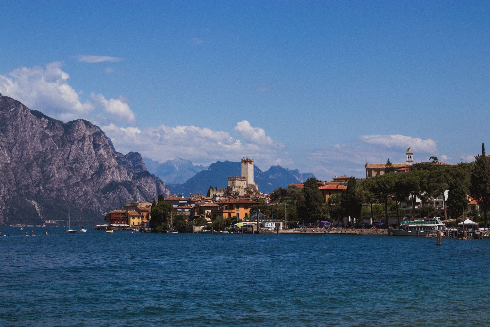 Malcesine on the eastern shore of Lake Garda, with a rocky mountain rising behind the waterfront