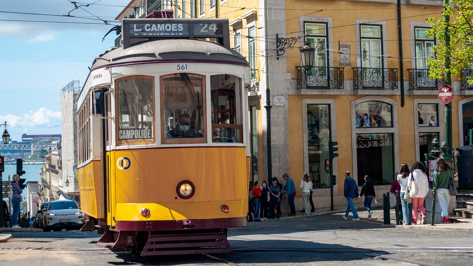 Yellow Lisbon tram on a city street